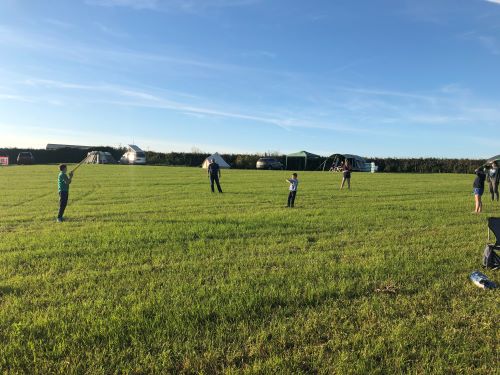 Treza camp site children playing in field